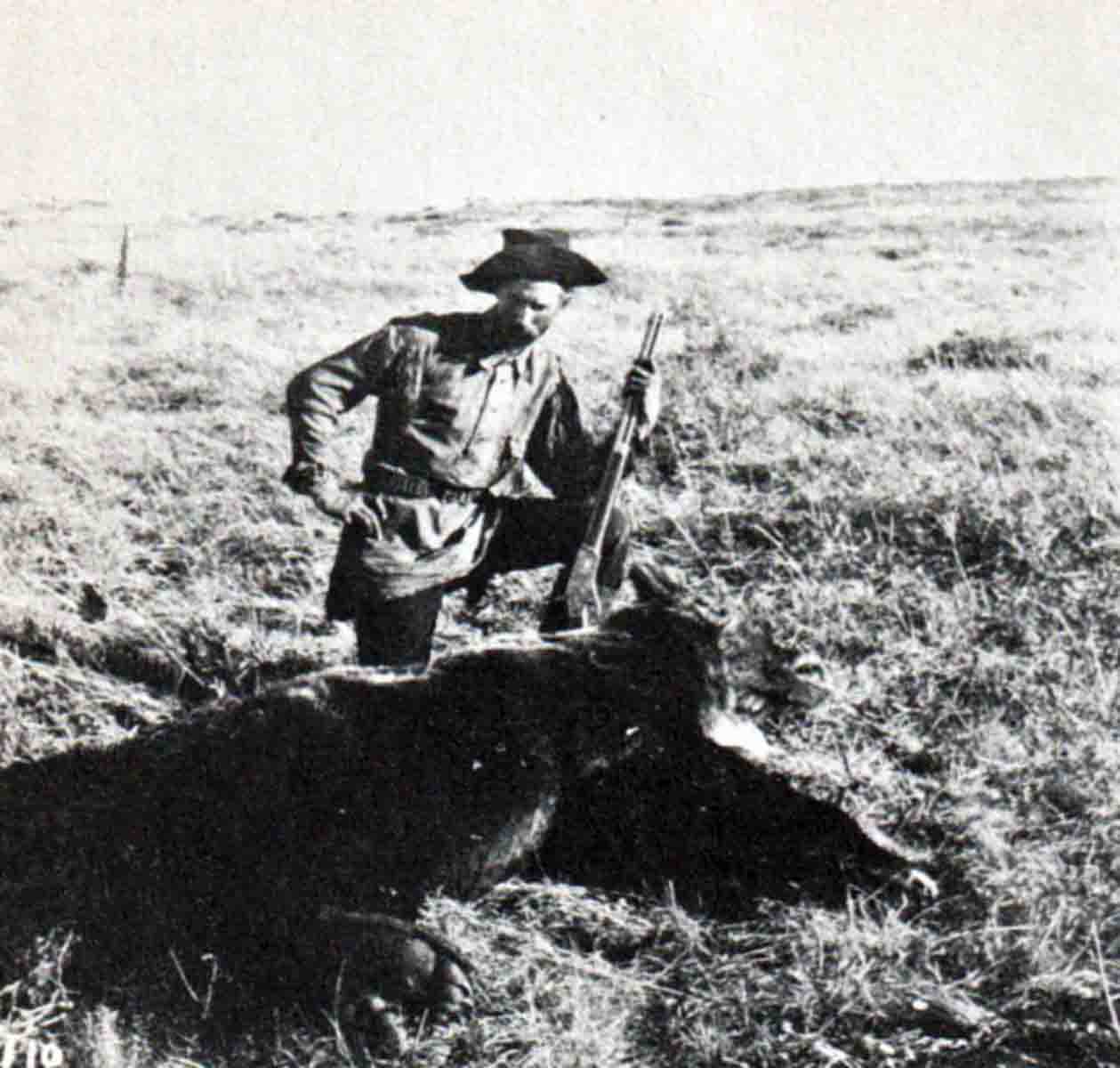 Huffman with a grizzly bear shot with the .44-40 Kennedy rifle. Photo credit University of Montana Archives.